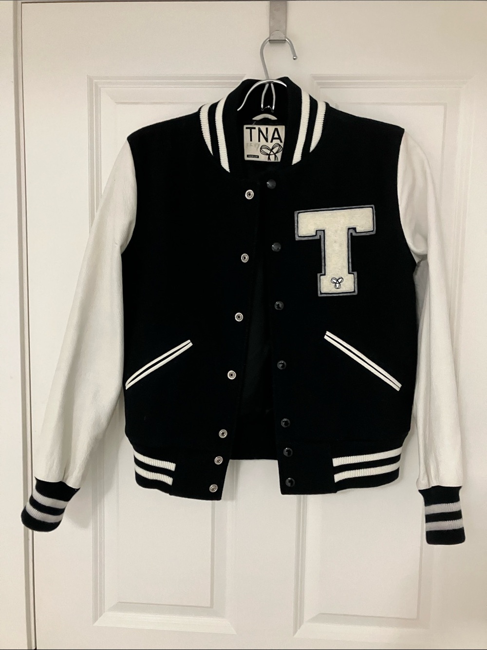 TNA , Aritzia women’s medium , varsity jacket with genuine leather jacket